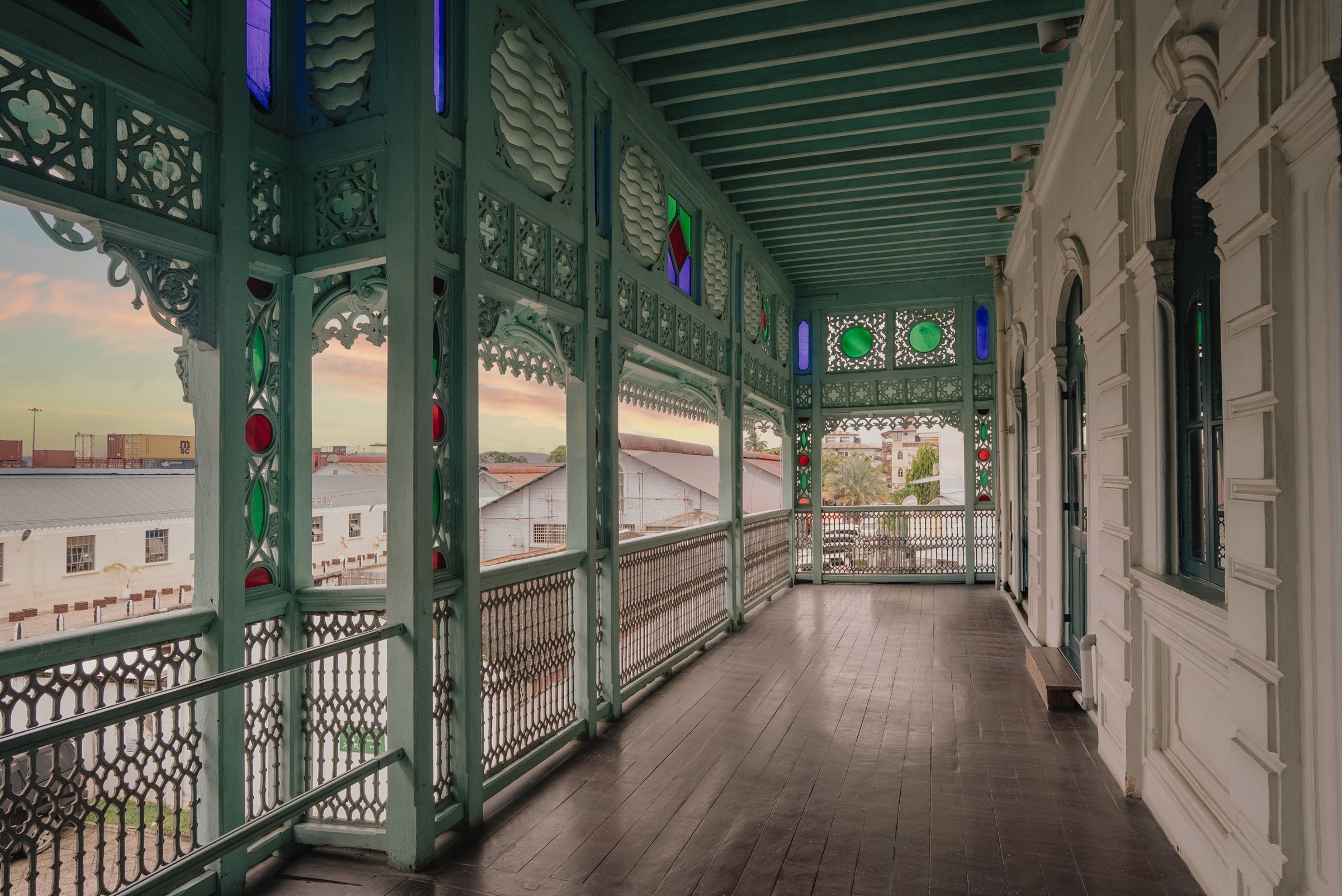 Carved balconies and coloured glass in Stone Town